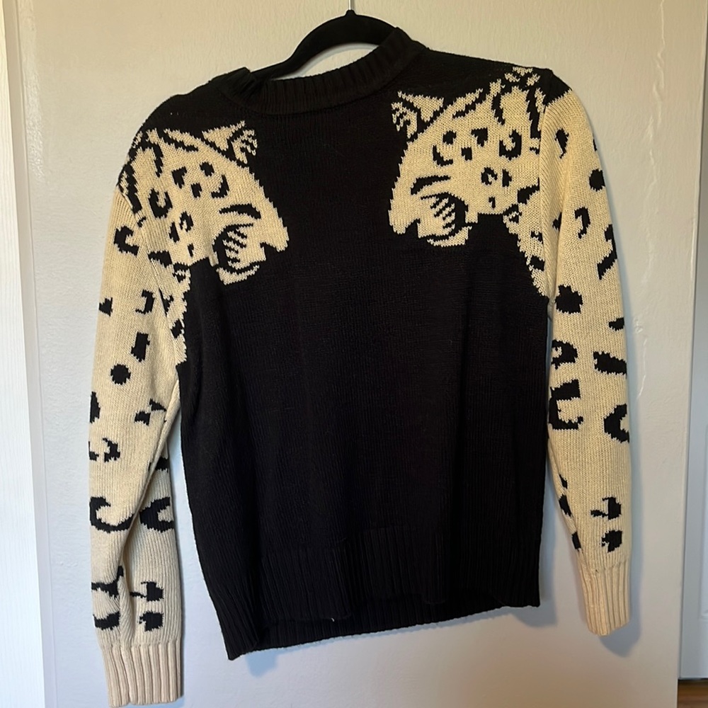 Black sweater with animal design